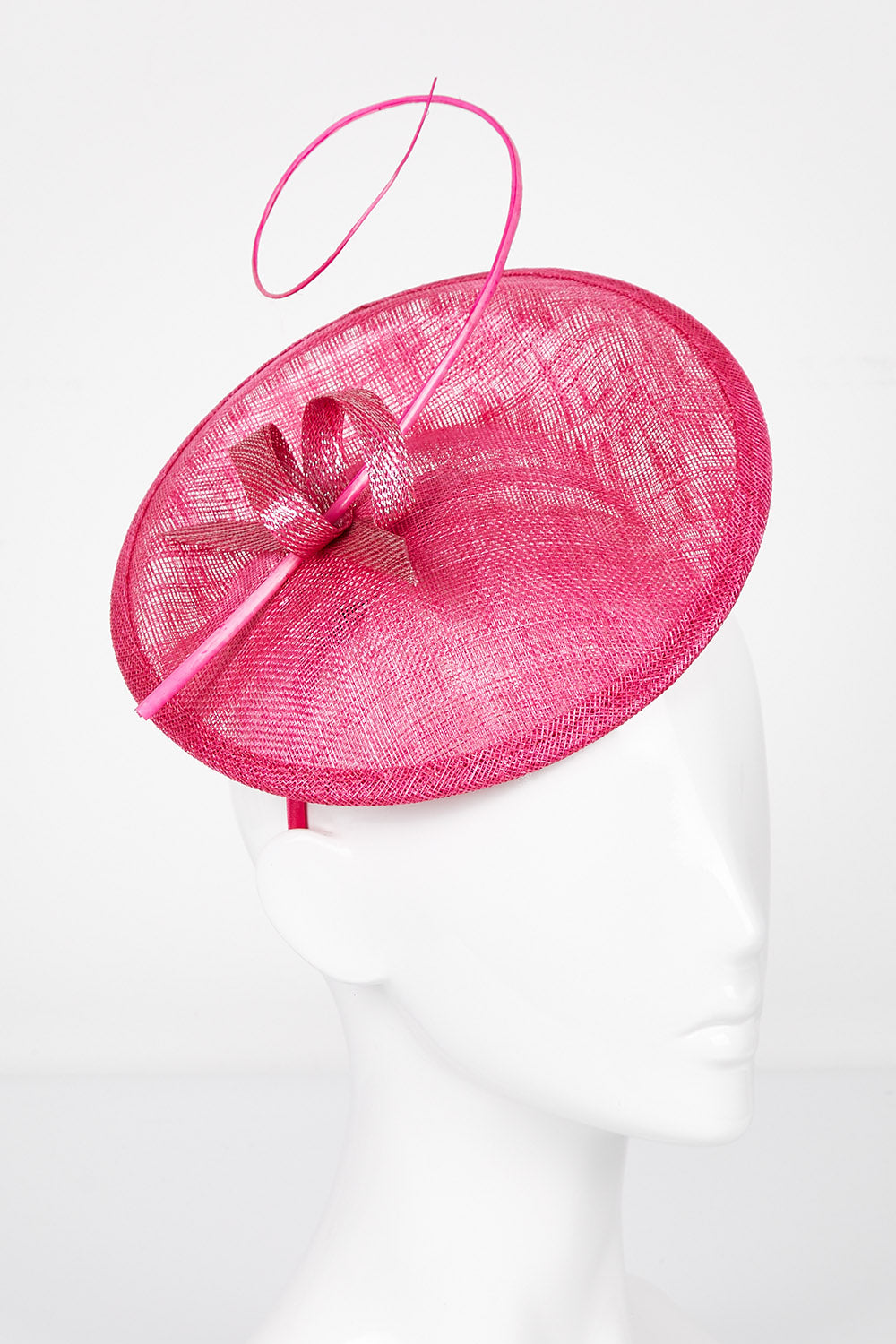 A model wearing size OneSize of the Zeya Fascinator in colour Hotpink (Pink), from the front, showing the whole outfit
