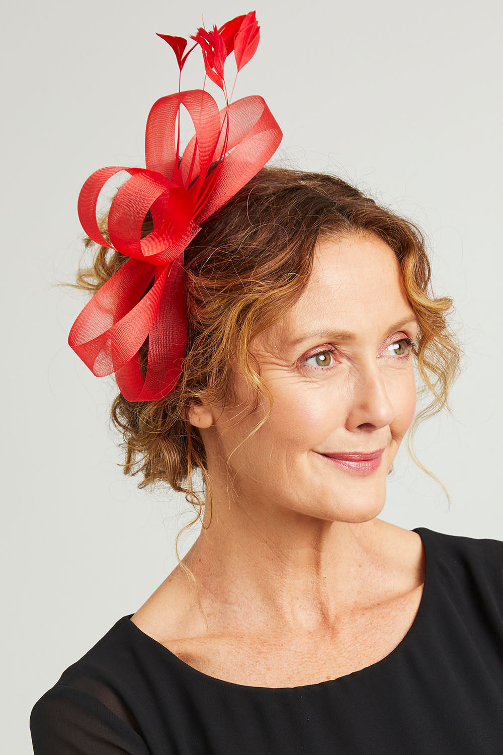 Model Emma wearing size OneSize of the Nyla Fascinator in colour Red (Red), from the front, showing the whole outfit