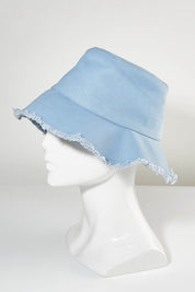 A model wearing size OneSize of the Nika Bucket Hat in colour Denim (Blue), from the front, showing the whole outfit