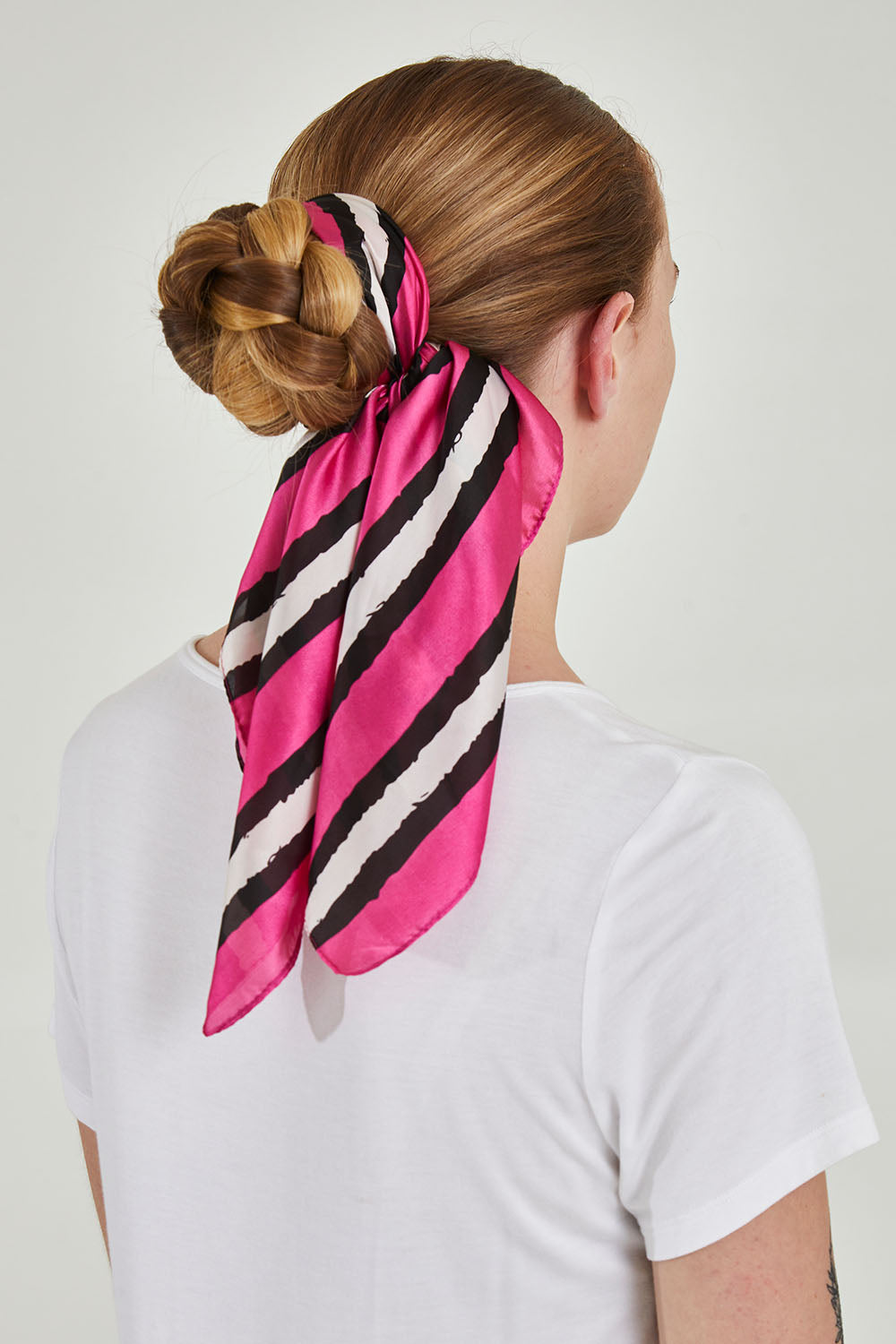 A model wearing size OneSize of the Hadley Hair Scarf in colour Pinkstripe (Pink), from the back