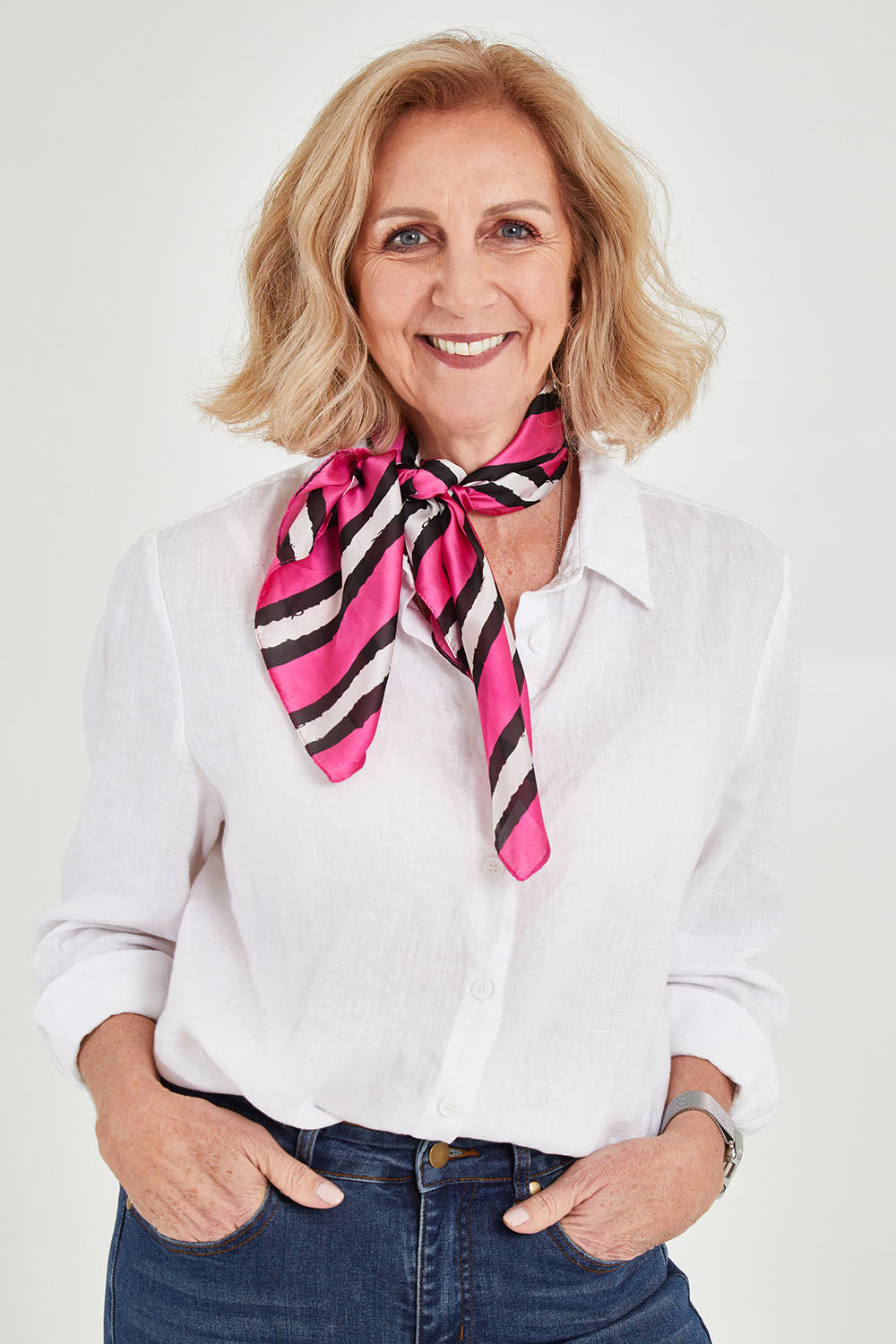 Model Sandy wearing size OneSize of the Hadley Hair Scarf in colour Pinkstripe (Pink), from the front, cropped image