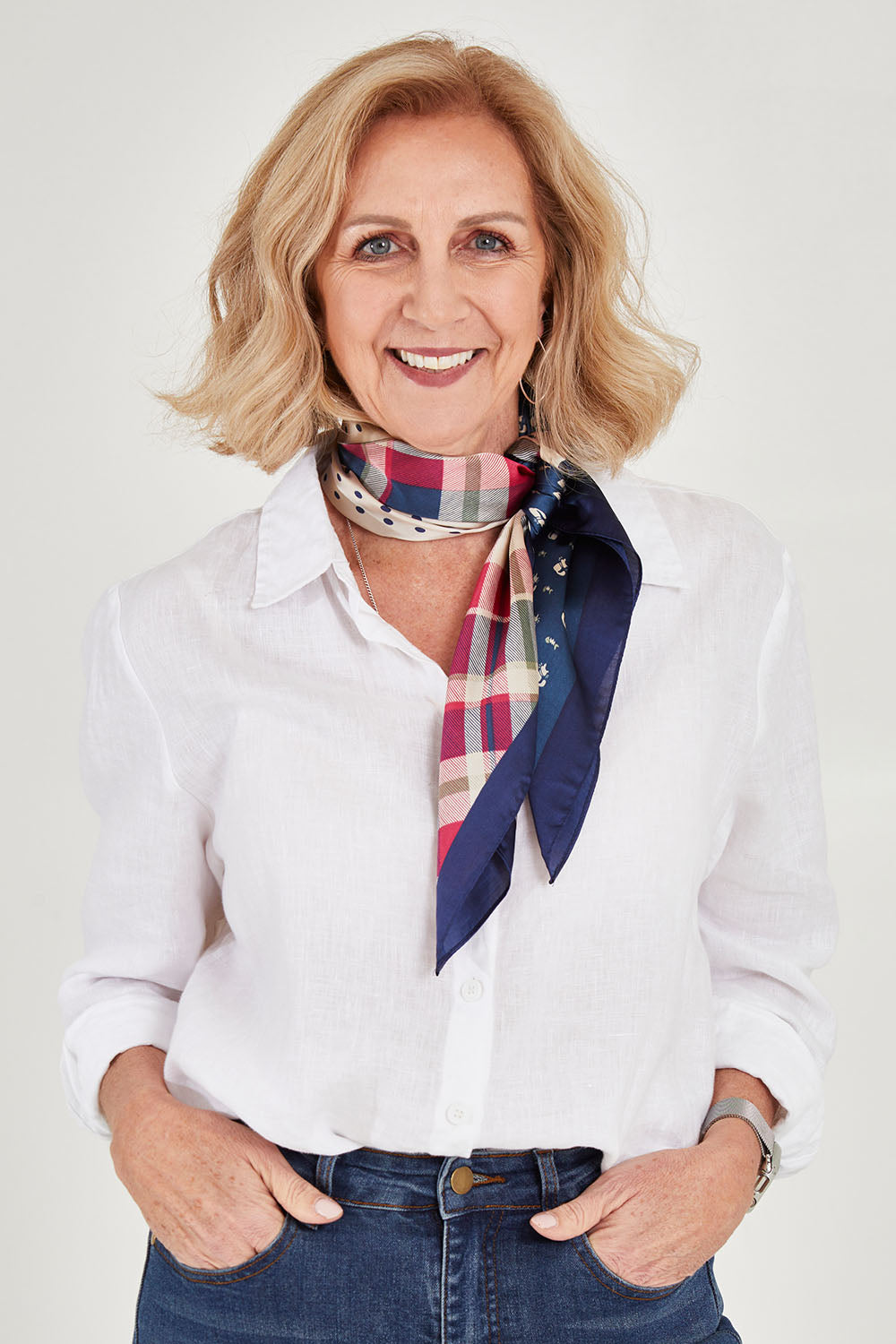 Model Sandy wearing size OneSize of the Federica Hair Scarf in colour Navyprint (Blue), from the front, cropped image