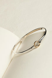 A model wearing the Oh Honey Bangle in colour Silver (Metallics), from the front, showing the whole outfit