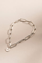 A model wearing the Vista Chain Bracelet in colour Silver (Metallics), from the front, showing the whole outfit