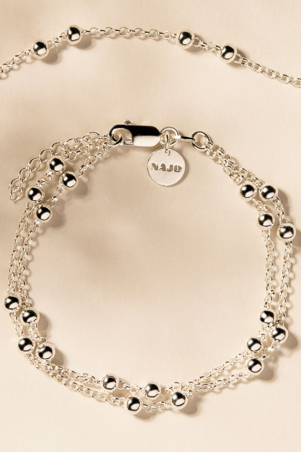 A model wearing the Mattina Silver Bracelet in colour Silver (Metallics), from the front, showing the whole outfit