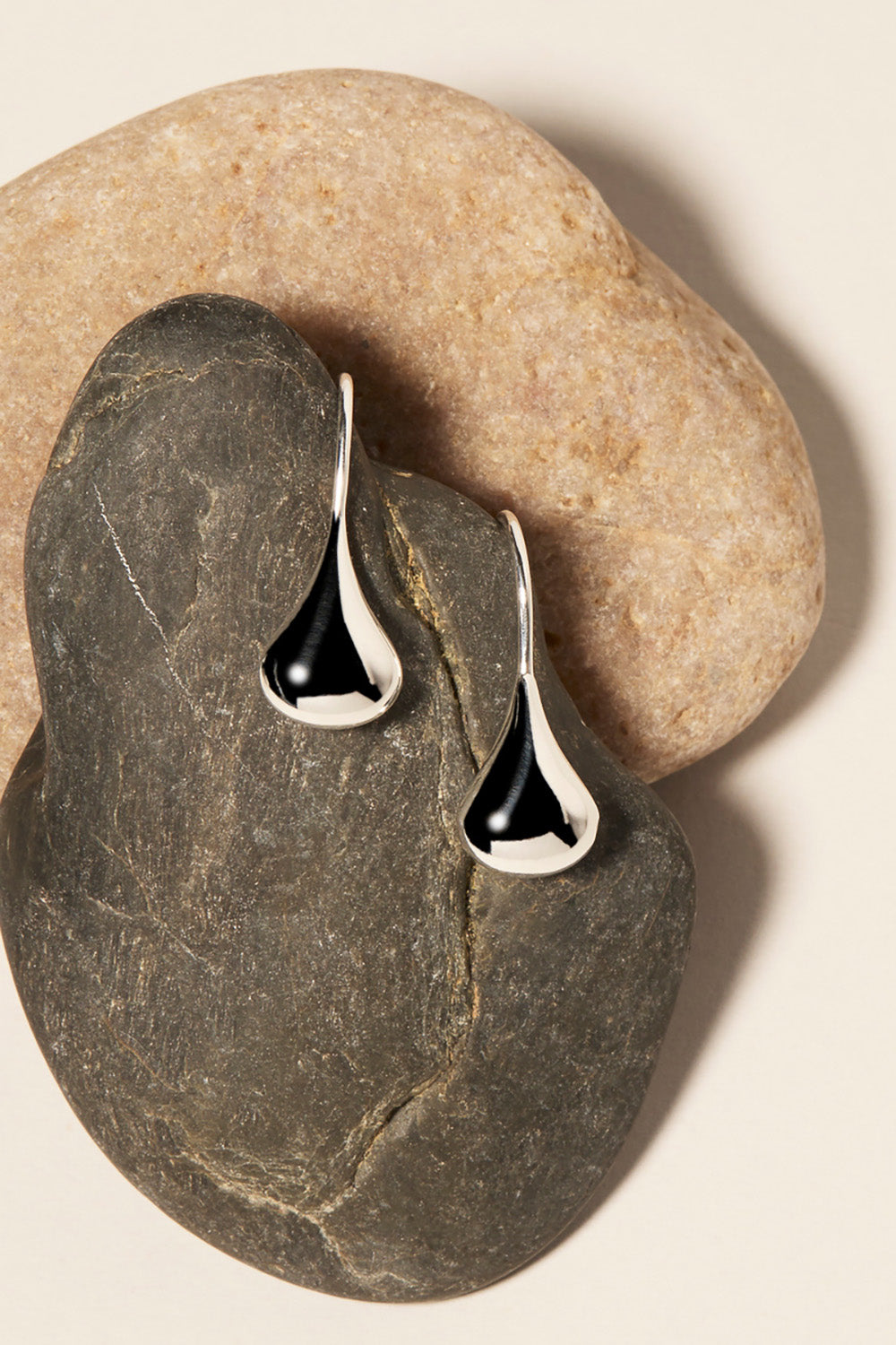 A model wearing the Baby Tears Earring in colour Silver (Metallics), from the front, showing the whole outfit
