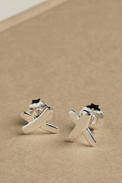 A model wearing the Sterling Silver Kiss Stud Earrings in colour Silver (Metallics), from the front, showing the whole outfit