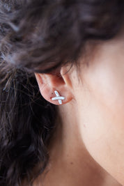 A model wearing the Sterling Silver Kiss Stud Earrings in colour Silver (Metallics), from the front, showing the whole outfit
