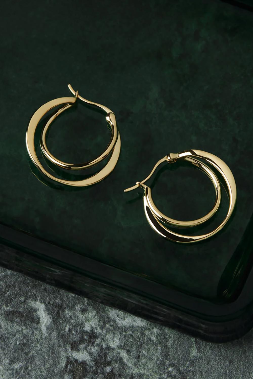 A model wearing the Eclipse Yellow Gold Hoop Earrings in colour Gold (Metallics), from the front, showing the whole outfit