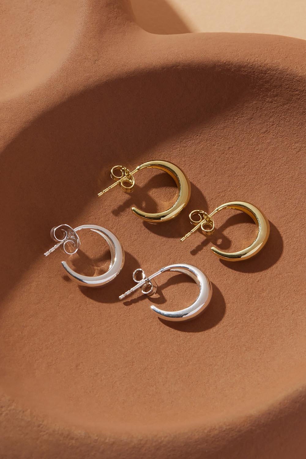 A model wearing the La Muse Silver Stud Hoop Earring in colour Silver (Metallics), from the front, showing the whole outfit