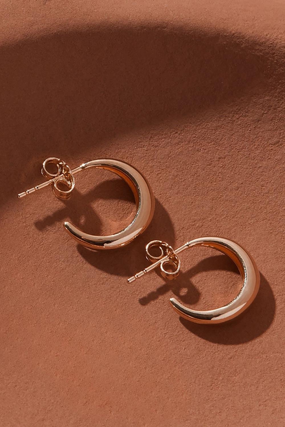 A model wearing the La Muse Rose Gold Stud Hoop Earring in colour Rosegold (Metallics), from the front, showing the whole outfit