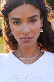 A model wearing the Vista Chain Necklace in colour Silver (Metallics), from the front, showing the whole outfit