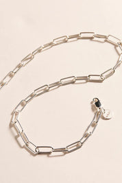 A model wearing the Vista Chain Necklace in colour Silver (Metallics), from the front, showing the whole outfit