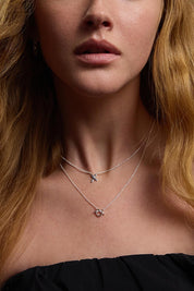 A model wearing the Eternal Silver Necklace in colour Silver (Metallics), from the front, cropped image