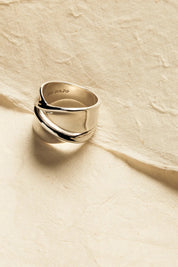 A model wearing the Somersault Sterling Silver Ring in colour Silver (Metallics), from the front, showing the whole outfit