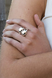 A model wearing the Waterfall Ring in colour Silver (Metallics), from the front, showing the whole outfit