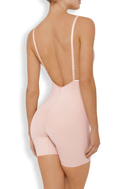 A model wearing the Body Define Backless Jumpsuit in colour WarmTaupe, from the back