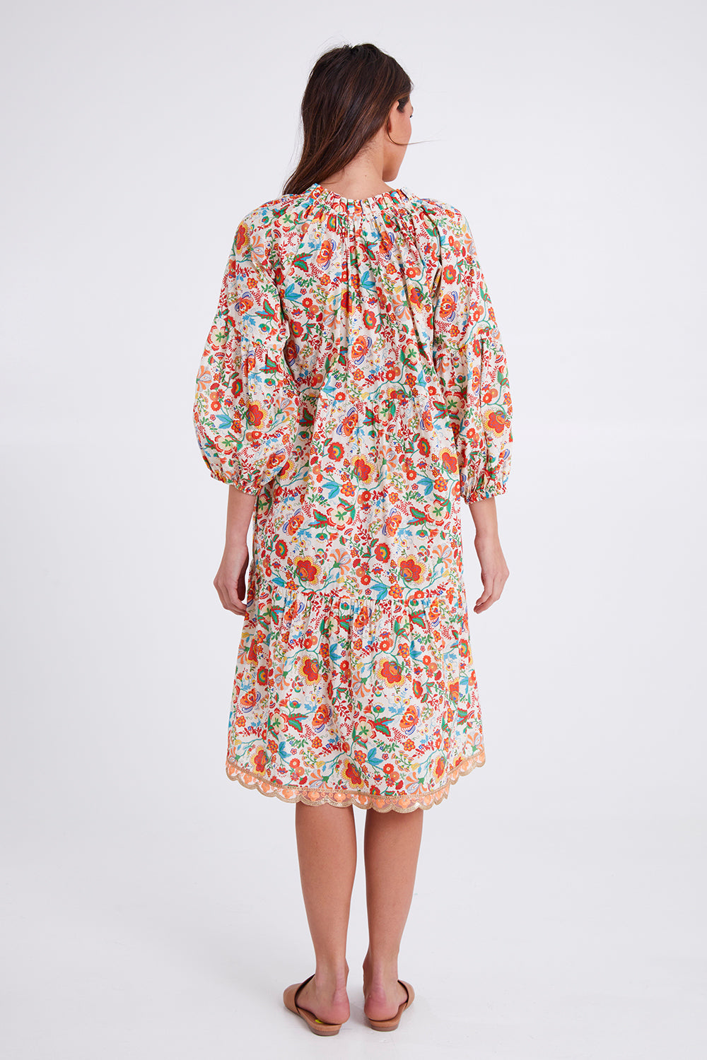 Model Madeline wearing size S of the Molly Dress in colour Woodstock (White), from the back