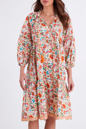 Model Madeline wearing size S of the Molly Dress in colour Woodstock (White), from the front, cropped image
