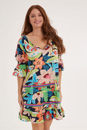 Model Sally wearing size S of the Kasbah Dress in colour Basque (Blue), from the front, cropped image