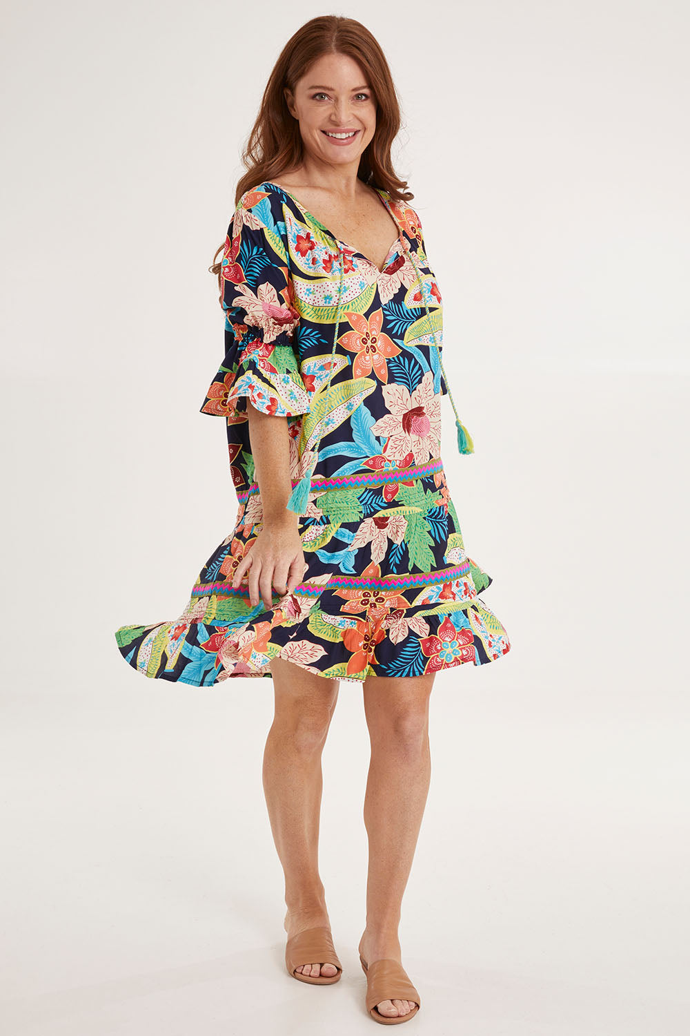 Model Sally wearing size S of the Kasbah Dress in colour Basque (Blue), from the front, showing the whole outfit