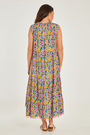 Model Georgia wearing size S of the Mabel Maxi in colour Jungle (Pink), from the back