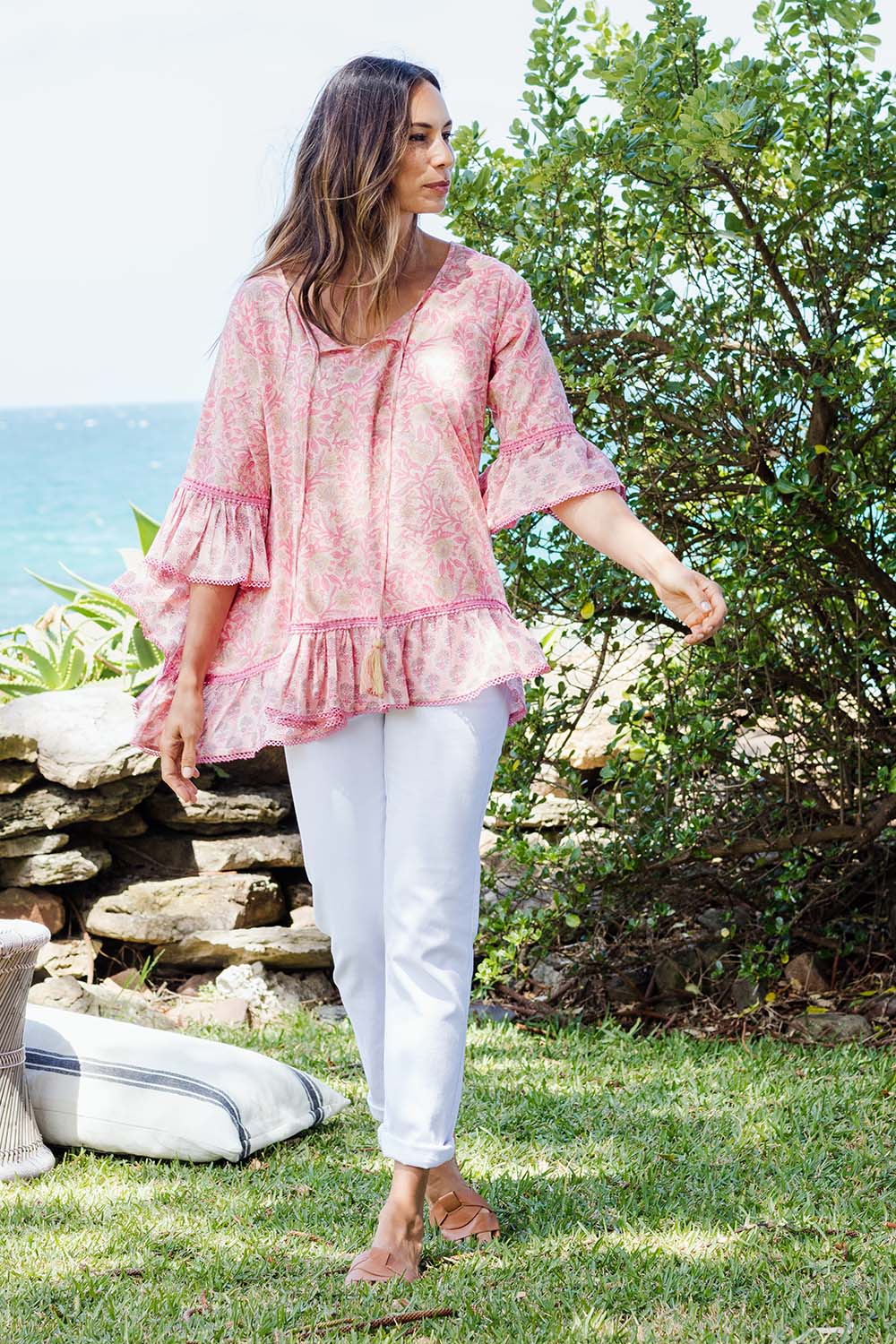 Model Amanda wearing size S of the Hacienda Tunic in colour Pink (Pink), from the front, showing the whole outfit