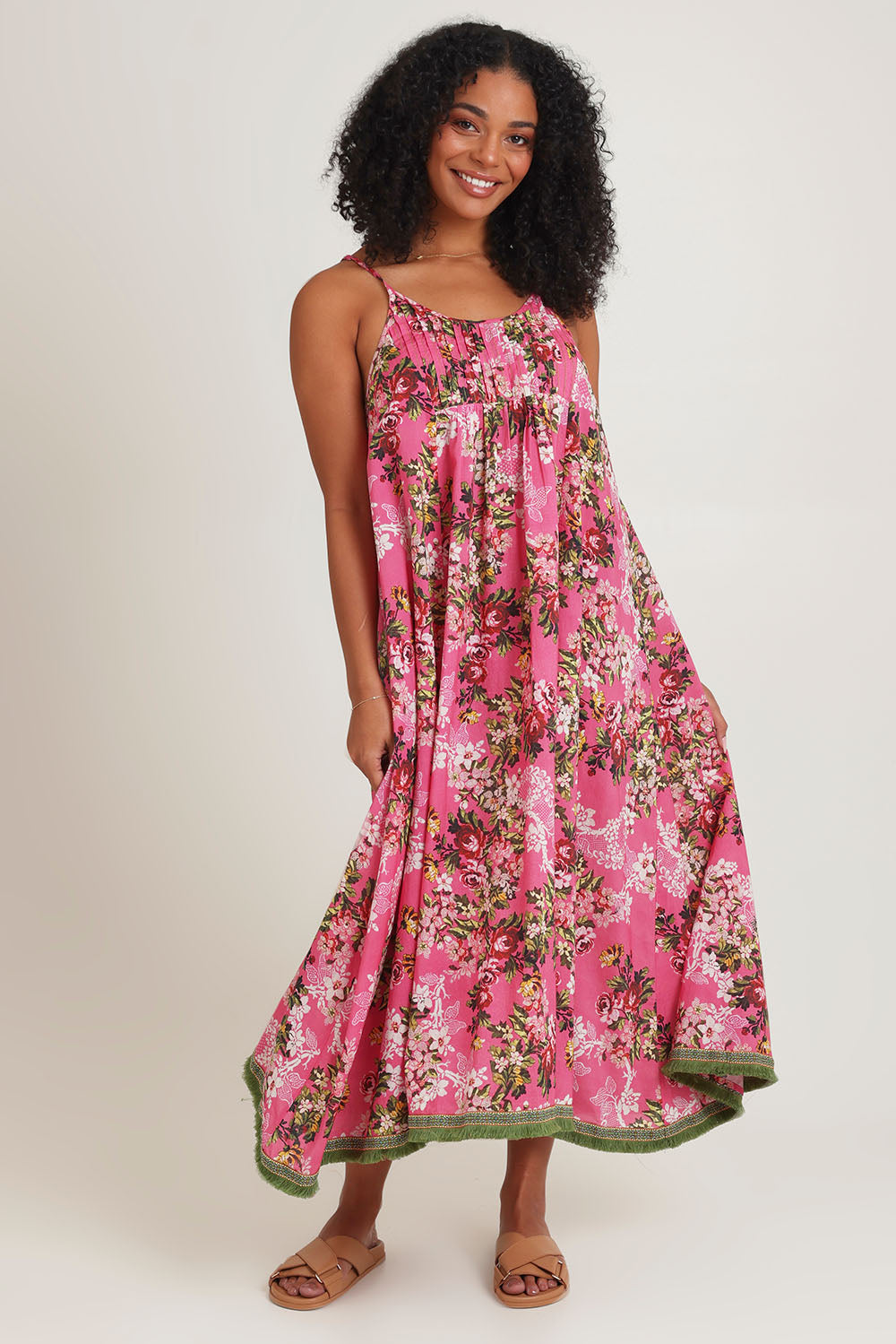 Model Ziara wearing size S of the Astrid Cotton Dress in colour Folly (Pink), from the front, showing the whole outfit