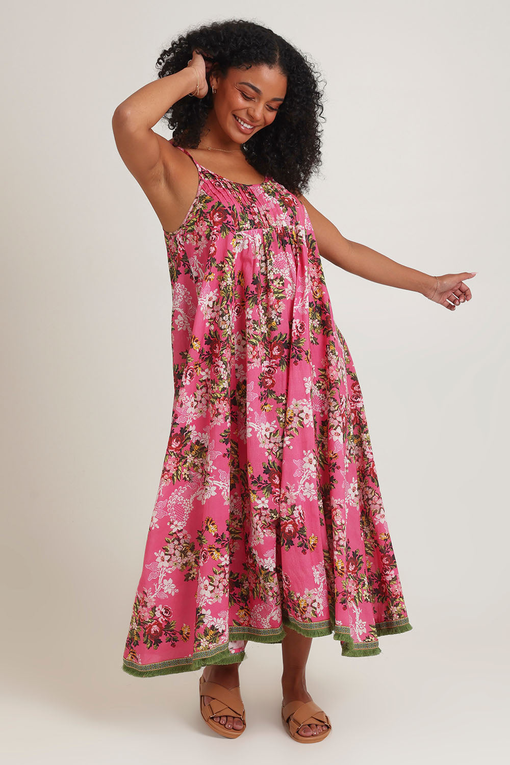 Model Ziara wearing size S of the Astrid Cotton Dress in colour Folly (Pink), from the front, showing the whole outfit