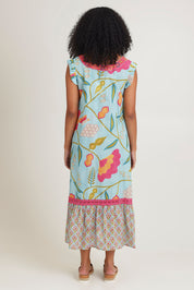 Model Ziara wearing size S of the Epson Maxi Dress in colour Avalon (Blue), from the back
