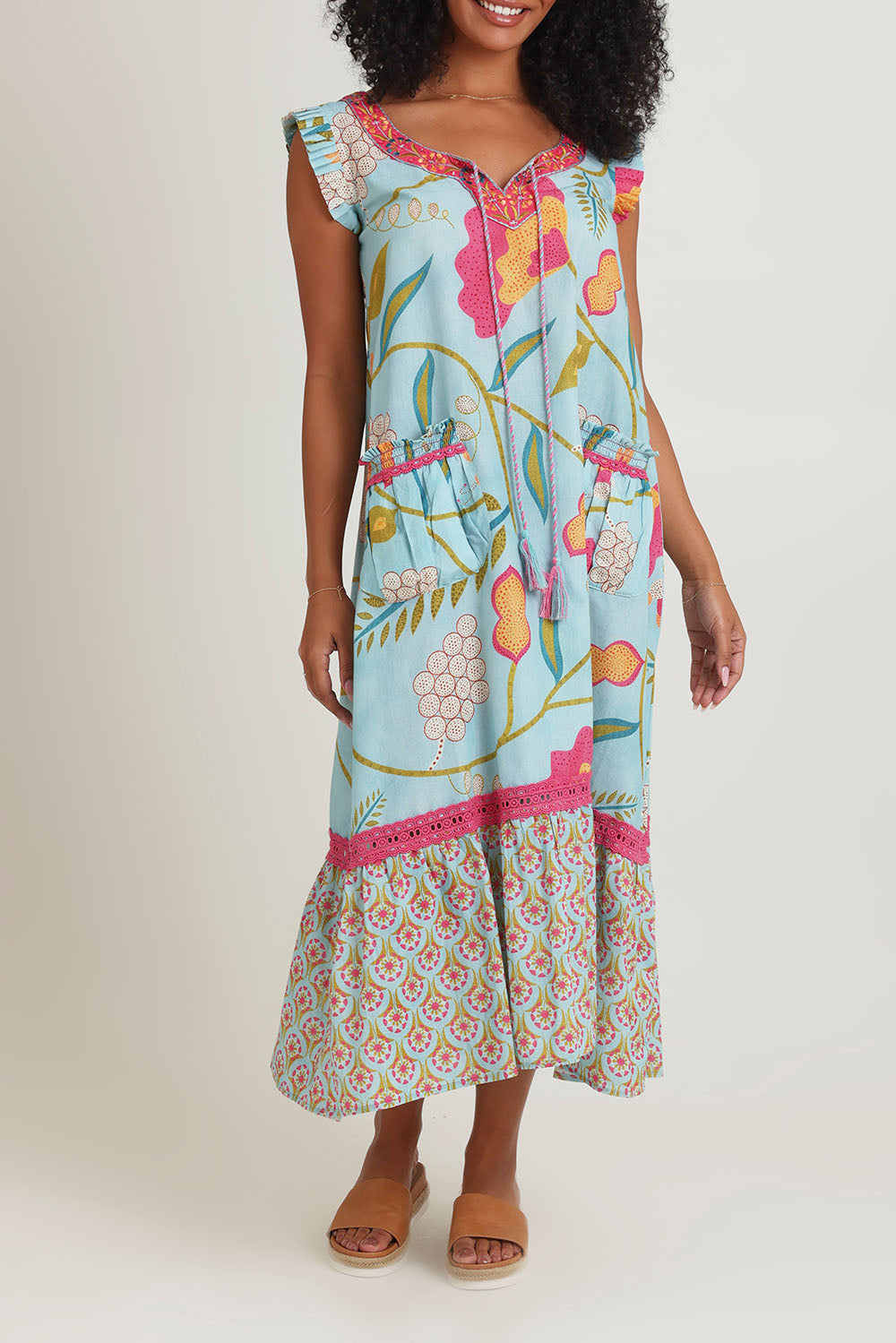 Model Ziara wearing size S of the Epson Maxi Dress in colour Avalon (Blue), from the front, cropped image