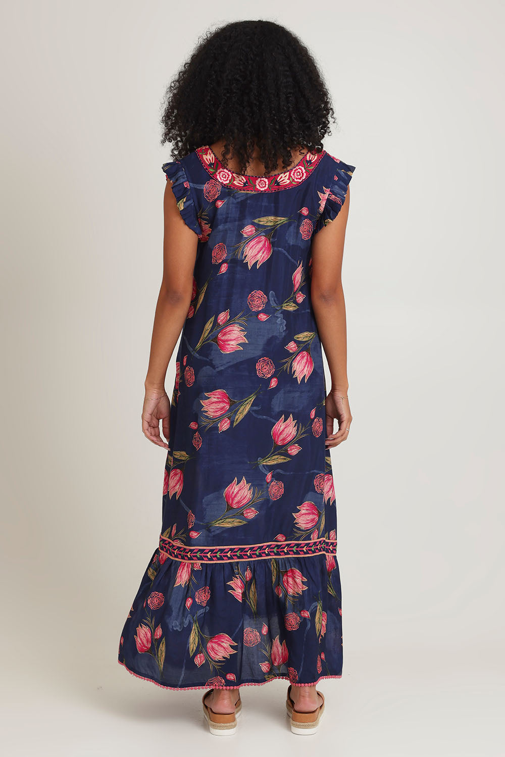 Model Ziara wearing size S of the Epson Maxi Dress in colour Frolic (Blue), from the back