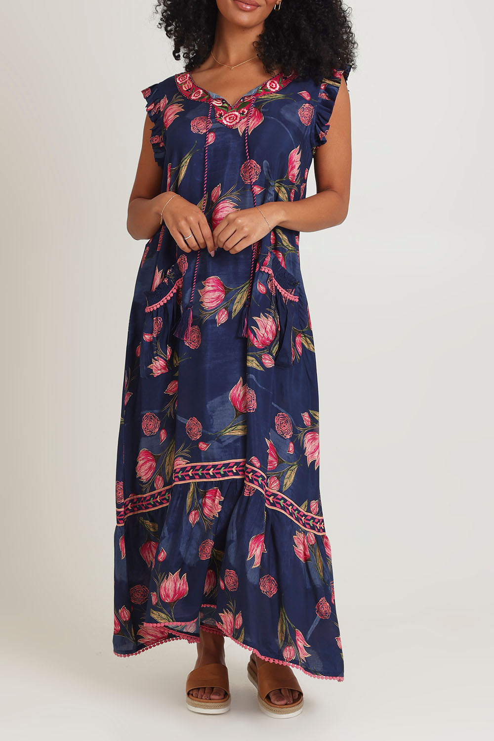 Model Ziara wearing size S of the Epson Maxi Dress in colour Frolic (Blue), from the front, cropped image