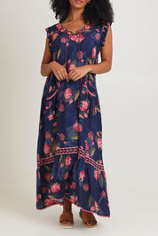 Model Ziara wearing size S of the Epson Maxi Dress in colour Frolic (Blue), from the front, cropped image