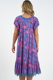 A model wearing the Sao Paulo Cotton Dress in colour Alessipink, from the back