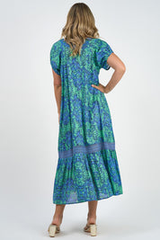 A model wearing the Sao Paulo Cotton Maxi Dress in colour Alessiablu (Blue), from the back