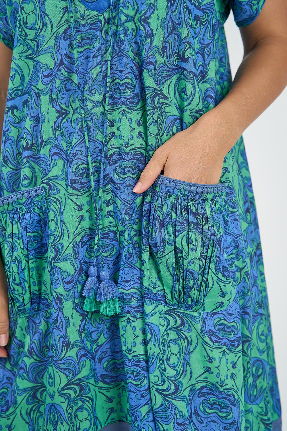 A model wearing the Sao Paulo Cotton Maxi Dress in colour Alessiablu (Blue), from the front, cropped image