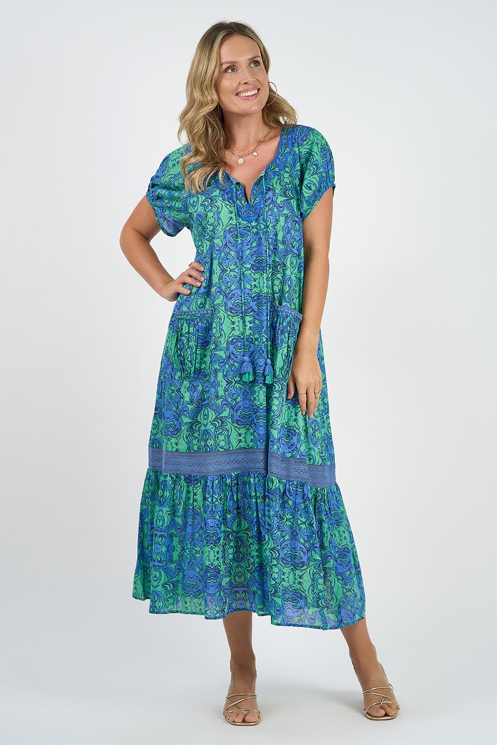 A model wearing the Sao Paulo Cotton Maxi Dress in colour Alessiablu (Blue), from the front, showing the whole outfit
