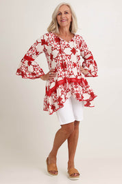 Model Sandy wearing size S of the Hacienda Cotton Tunic in colour Jemmared (Red), from the front, showing the whole outfit