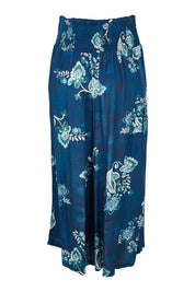 Product shot of the Hendrix Pant in colour Selene (Blue), from the back