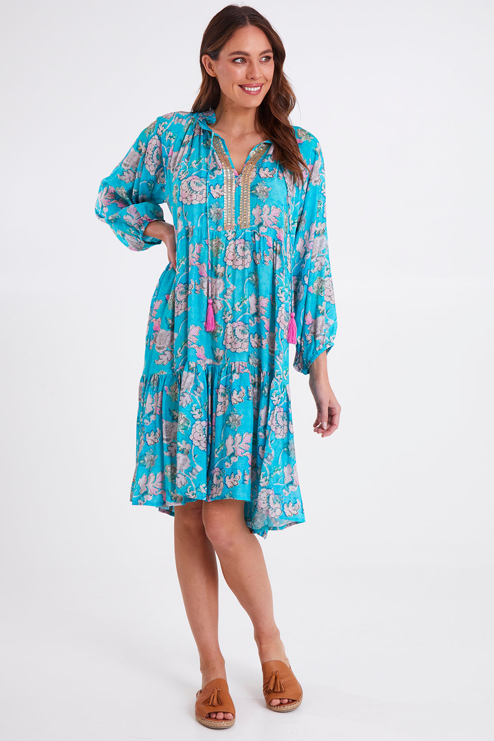 Model Madeline wearing size S of the Molly Dress in colour Derpink (Blue), from the front, showing the whole outfit