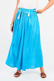 A model wearing the Hendrix Pant in colour Turquoise (Blue), from the front, cropped image
