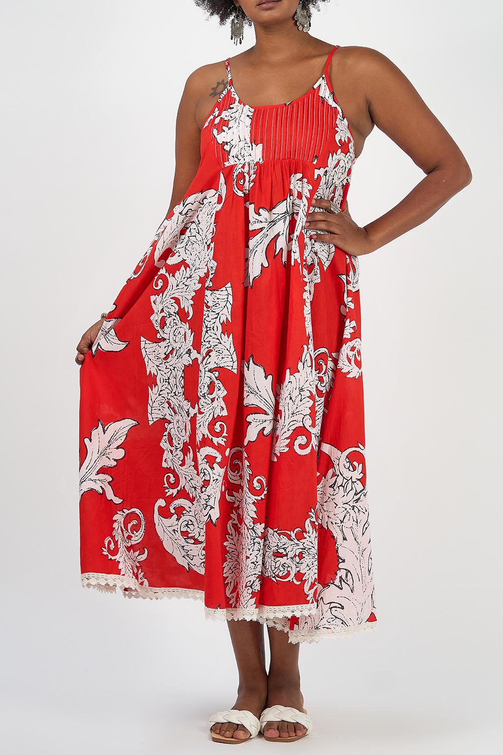 A model wearing the Astrid Cotton Maxi Dress in colour Pompeiired (Red), from the front, cropped image