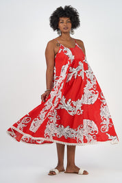 A model wearing the Astrid Cotton Maxi Dress in colour Pompeiired (Red), from the front, showing the whole outfit