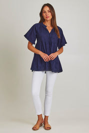 Model Madeline wearing size S of the Matilda Cotton Short Sleeve Top in colour Paisleynav (Blue), from the front, showing the whole outfit