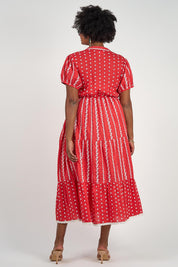 A model wearing the Frida Cotton Maxi Dress in colour Sorrento (Red), from the back