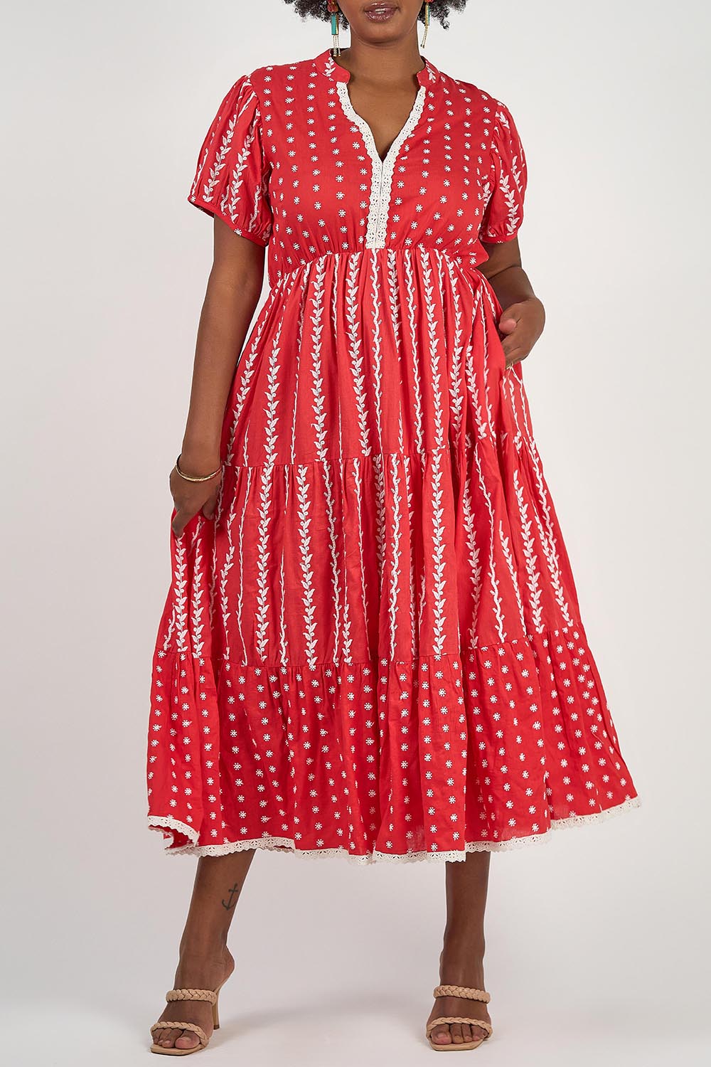 A model wearing the Frida Cotton Maxi Dress in colour Sorrento (Red), from the front, cropped image