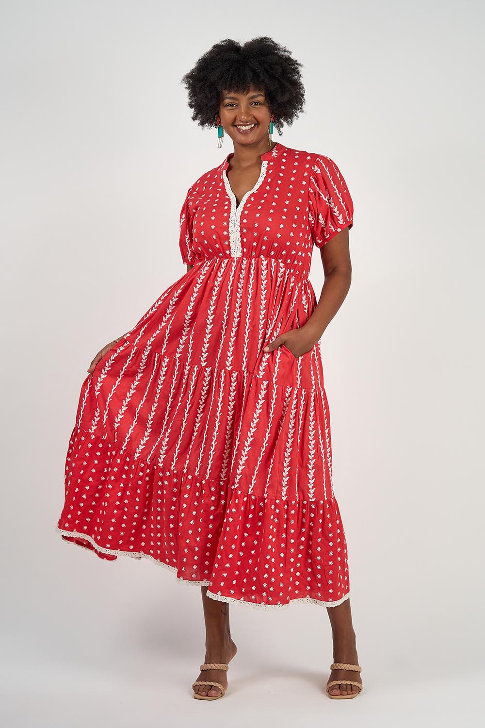A model wearing the Frida Cotton Maxi Dress in colour Sorrento (Red), from the front, showing the whole outfit