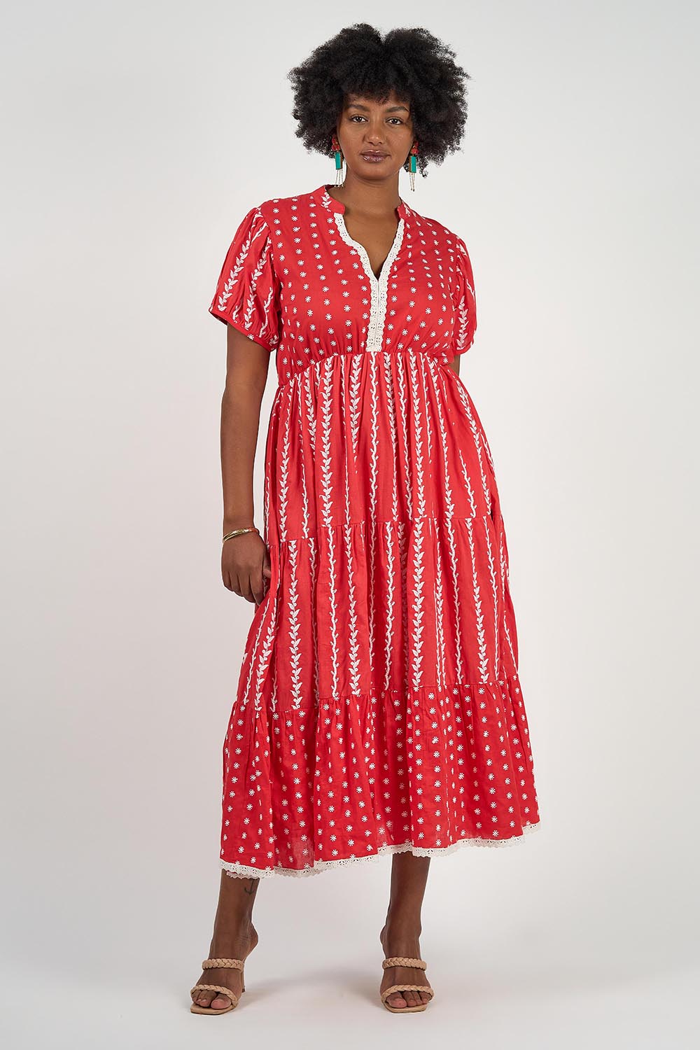 A model wearing the Frida Cotton Maxi Dress in colour Sorrento (Red), from the front, showing the whole outfit