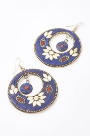 A model wearing size OneSize of the Tile Earrings in colour Blue (Blue), from the front, showing the whole outfit